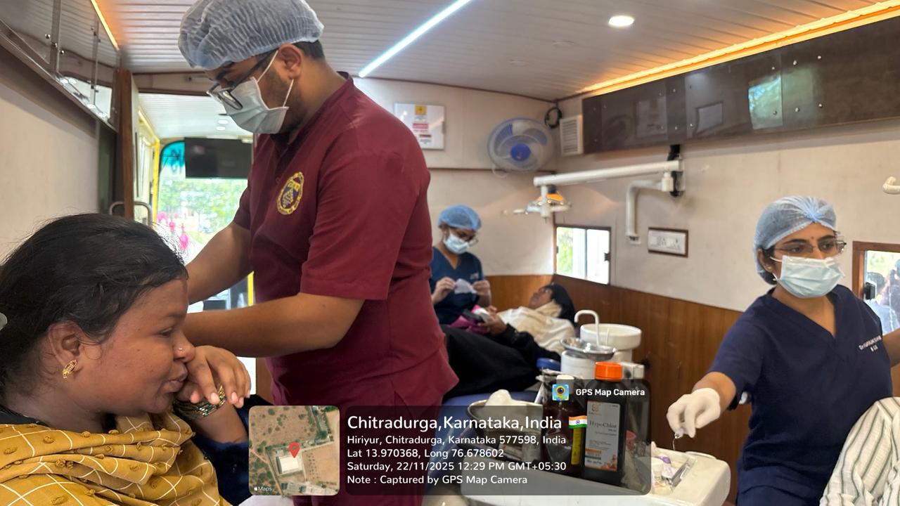 Dentist providing treatment inside the mobile dental unit